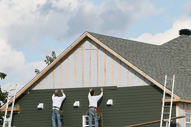 Professional Storm Damage Siding Repair technician working in Greenvale, NY